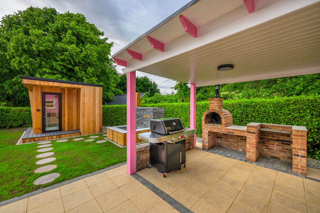 An image of Lily's Pink House taken from near the plunge pool