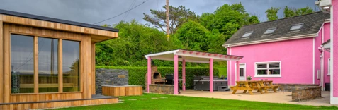 An image of the Rosie's Cottage Sauna, Plunge Pool, Hot tub, and outside relaxation area.